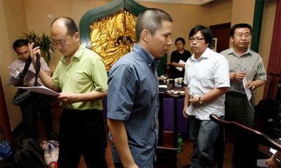 In mid-July, Xu Zhiyong, center, a legal scholar, met with lawyers at a restaurant in Beijing. Later that month, he was detained.