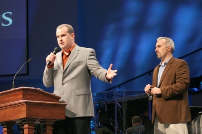 Alex Kendrick, co-writer of the upcoming film ''Courageous,'' speaks about the film while his brother and co-writer Stephen Kendrick stands behind him during the announcement service Sunday, November 15, 2009 in Albany, Ga.