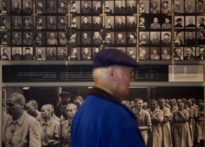 A visitor looks at the display at the Yad Vashem Holocaust memorial in Jerusalem on the international Holocaust remembrance day Wednesday, Jan. 27, 2010. The International Holocaust remembrance day marks the liberation of the Auschwitz concentration camp on Jan. 27, 1945.