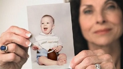 Pam Tebow holds a baby picture of Florida Gators’ star Tim Tebow in a Super Bowl XLIV commercial, produced by Focus on the Family.