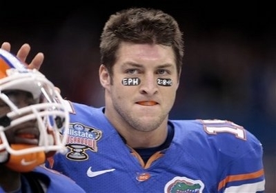 In this Jan. 1, 2010 photo, Florida quarterback Tim Tebow stands on the sidelines during the Sugar Bowl football game at the Louisiana Superdome in New Orleans.