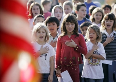 Fairmeadow Elementary School students recite the Pledge of Allegiance during a school assembly in Palo Alto, Calif., Monday, Nov. 5, 2007.