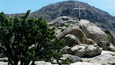 This undated photo shows the Mojave War Memorial cross on an outcrop known as Sunrise Rock in the Mojave National Preserve.