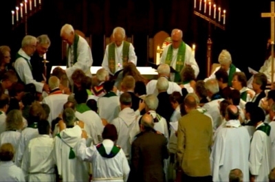 Bishops in the Evangelical Lutheran Church in America lay hands on three lesbian ministers during the Rite of Reception on Saturday, Sept. 18, 2010.