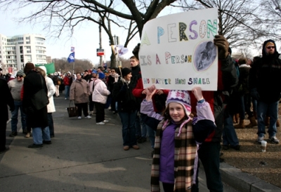 A young girl holds up a pro-life sign with the help of her father during the 2011 March for Life in Washington, D.C., Monday, Jan. 24.