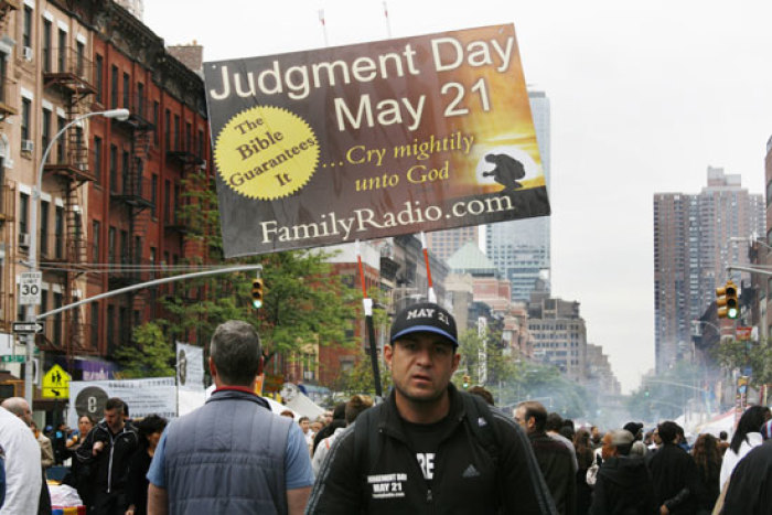 A member of the Family Radio group is seen at the International 9th Avenue Food Festival Saturday, May 14, 2011 in New York. Members are travelling the country in RVs called “Project Caravan” guaranteeing that Judgment Day is May 21, 2011 and that the world will end on October 21, 2011. The apocalyptic Christian group is led by 89 year old Harold Camping.