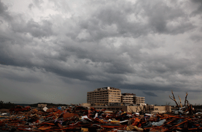 A view of the devastation after a tornado blew the roof off the St. John's Regional Medical Center, where about 180 patients cowered as the fierce winds blew, in Joplin, Missouri May 23, 2011. A monster tornado killed at least 116 people in Joplin when it tore through the heart of the small Midwestern city, destroying thousands of homes and businesses.