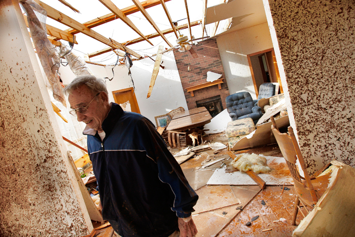 Ken Haebaum stands in his mud-splattered kitchen after a tornado ripped through the Falcon Lake area of Piedmont, Oklahoma May 24, 2011. Haebaum and his wife sought shelter from the tornado in the hallway behind the door on the right side of the photo. Several tornadoes touched down in Oklahoma on Tuesday afternoon, the largest one striking El Reno, west of Oklahoma City, and continuing to the northeast, the National Weather Service said. The living room is seen in the background.