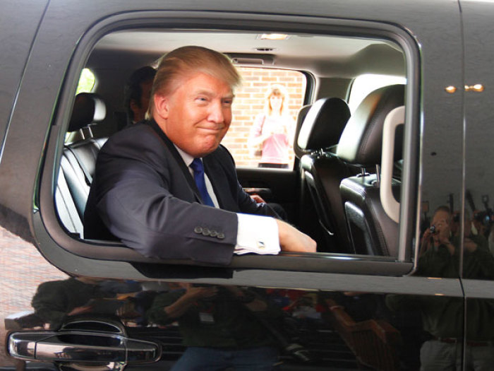 Real estate magnate Donald Trump smiles as he leaves a Greater Nashua Chamber of Commerce business expo at the Radisson Hotel in Nashua, New Hampshire, May 11 2011.