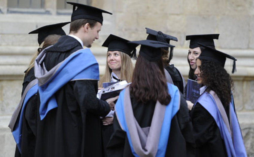 A group of graduates gather after a graduation ceremony at Oxford University, England, May 28, 2011.