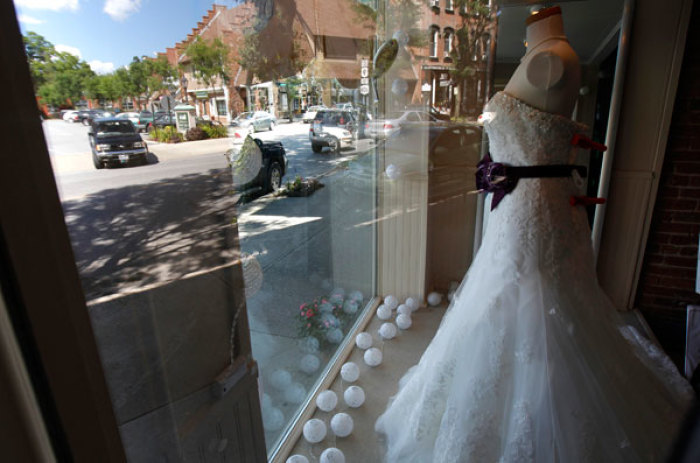 A wedding dress is displayed in a window in the Chamonix dress shop in the center of Rhinebeck, New York, July 26, 2010.