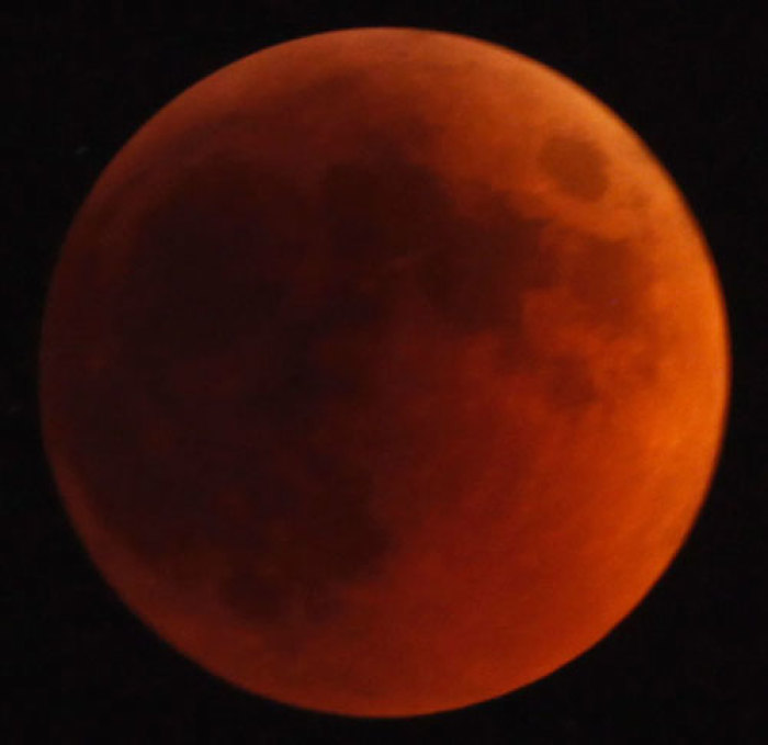 A shadow falls on the moon as it undergoes a total lunar eclipse as seen from Jerusalem June 15, 2011.