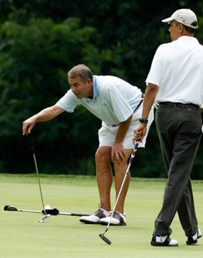 U.S. President Barack Obama and U.S. Speaker of the House John Boehner (L) are seen on the first green at Andrews Air Force Base in Maryland, June 18, 2011.