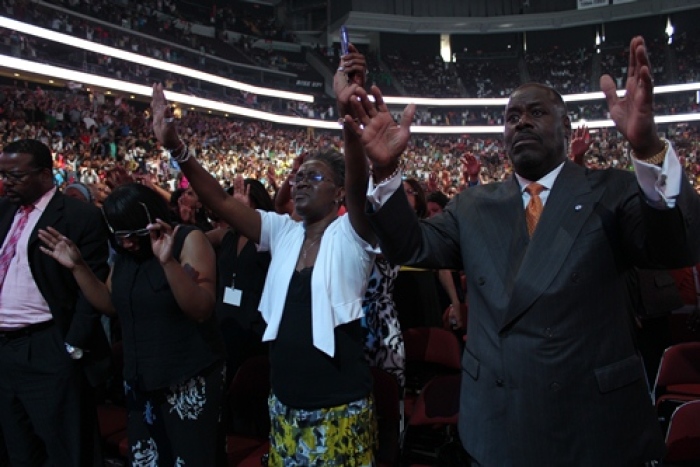 Attendees react to Bishop T.D. Jakes' sermon during the McDonald's Gospelfest at the Prudential Center in Newark, N.J.