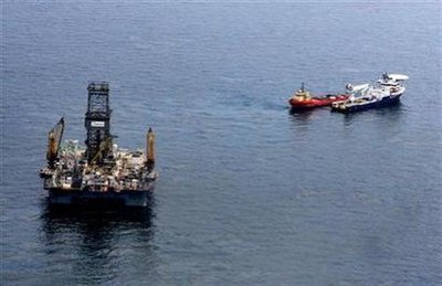 Oil floats on the surface of the Gulf of Mexico around the Transocean Development Driller III, which is drilling a relief well, at the site of the Deepwater Horizon oil spill in the Gulf of Mexico June 2, 2010.