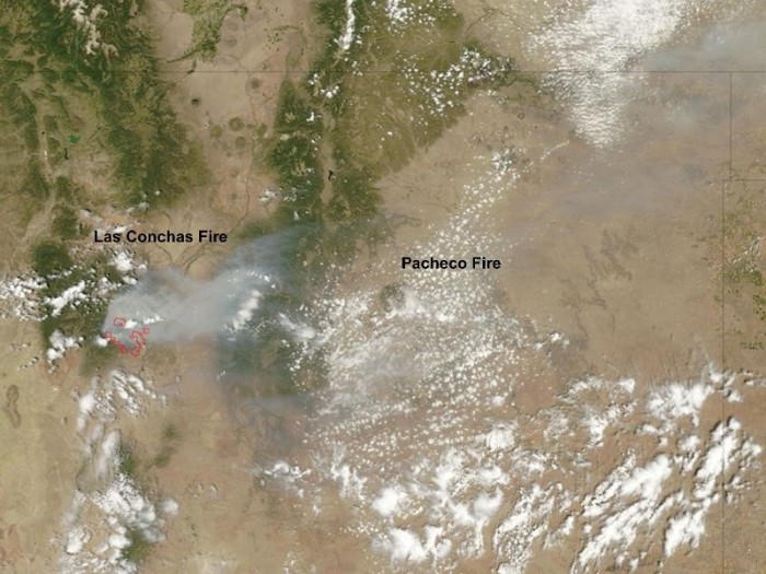 NASA's Terra satellite flew over New Mexico and captured this image that shows the smoke and heat (in red) from the Las Conchas fire near Los Alamos. The smoke from the nearby Pacheco fire (east) is also somewhat visible in the image.