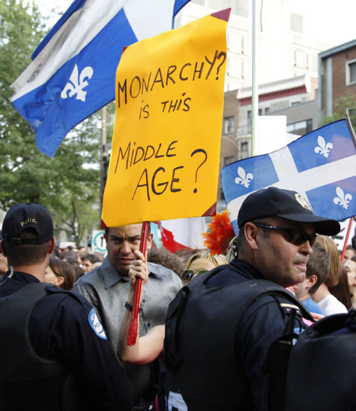 Demonstrators protest before the arrival of Britain's Prince William and his wife Catherine, Duchess of Cambridge, at the Institut de tourisme et d'hotellerie du Quebec in Montreal July 2, 2011. Prince William and his wife Catherine are on a royal tour of Canada from June 30 to July 8.