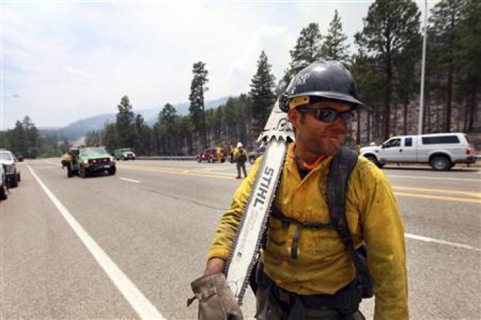 A fire crew member is seen as fire crews are deployed in order to attack hotspots from the Las Conchas wildfire near Los Alamos, New Mexico June 30, 2011.