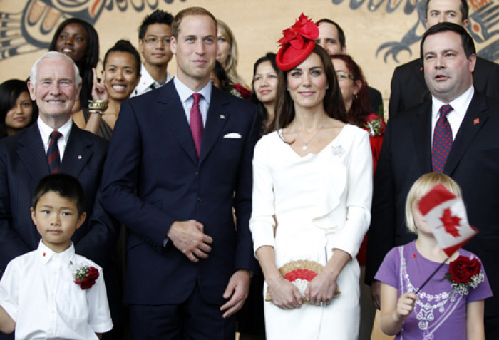 Canada's Governor General David Johnston (L), Britain's Prince William, his wife Catherine, the Duchess of Cambridge and Canada's Minister of Citizenship, Immigration and Multiculturalism Jason Kenney (R) pose for a photo with new Canadian citizens following a citizenship ceremony at the Canadian Museum of Civilization in Hull, Quebec near Ottawa July 1, 2011. Prince William and his wife Catherine, Duchess of Cambridge, are on a royal tour of Canada from June 30 to July 8.