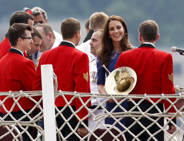 Catherine, Duchess of Cambridge, greets members of the band following a prayer service on board the HMCS Montreal in Quebec City July 3, 2011. Prince William and his wife Catherine are on a royal tour from June 30 to July 8.