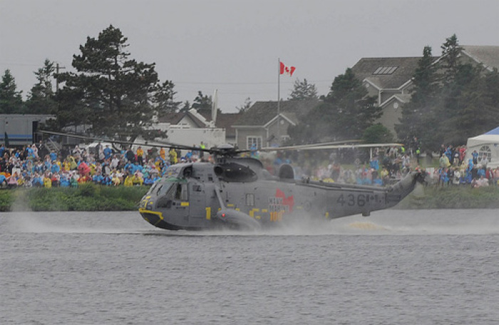 Prince William safely lands his Sea King helicopter in the Canadian river, showing his expert pilot skills to thousands of spectators, July 4th, 2011.