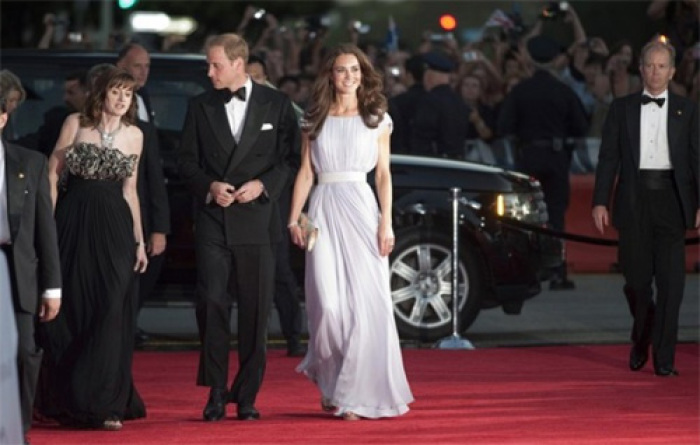 BAFTA Chief Executive Amanda Berry (L), Britain's Prince William and his wife Catherine, Duchess of Cambridge, walk the red carpet as they arrive at the BAFTA Brits to Watch event in Los Angeles, California July 9, 2011. Britain's Prince William and his wife Catherine, Duchess of Cambridge, are on a royal visit to California from July 8 to July 10.
