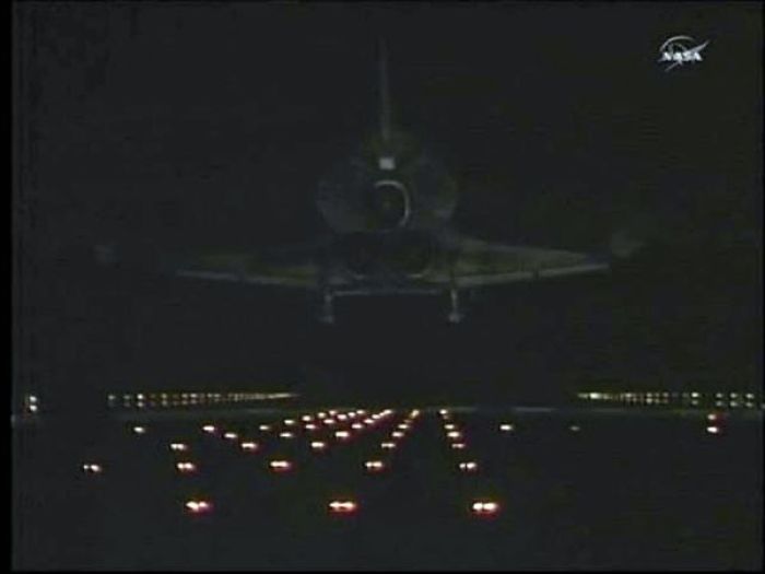 The space shuttle Atlantis makes a night landing at the Kennedy Space Center in Florida in this image from NASA TV July 21, 2011.