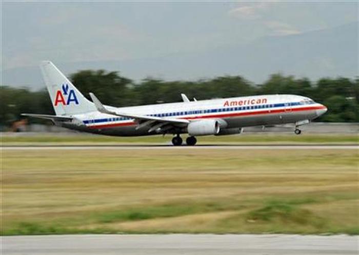An American Airlines jet touching down.