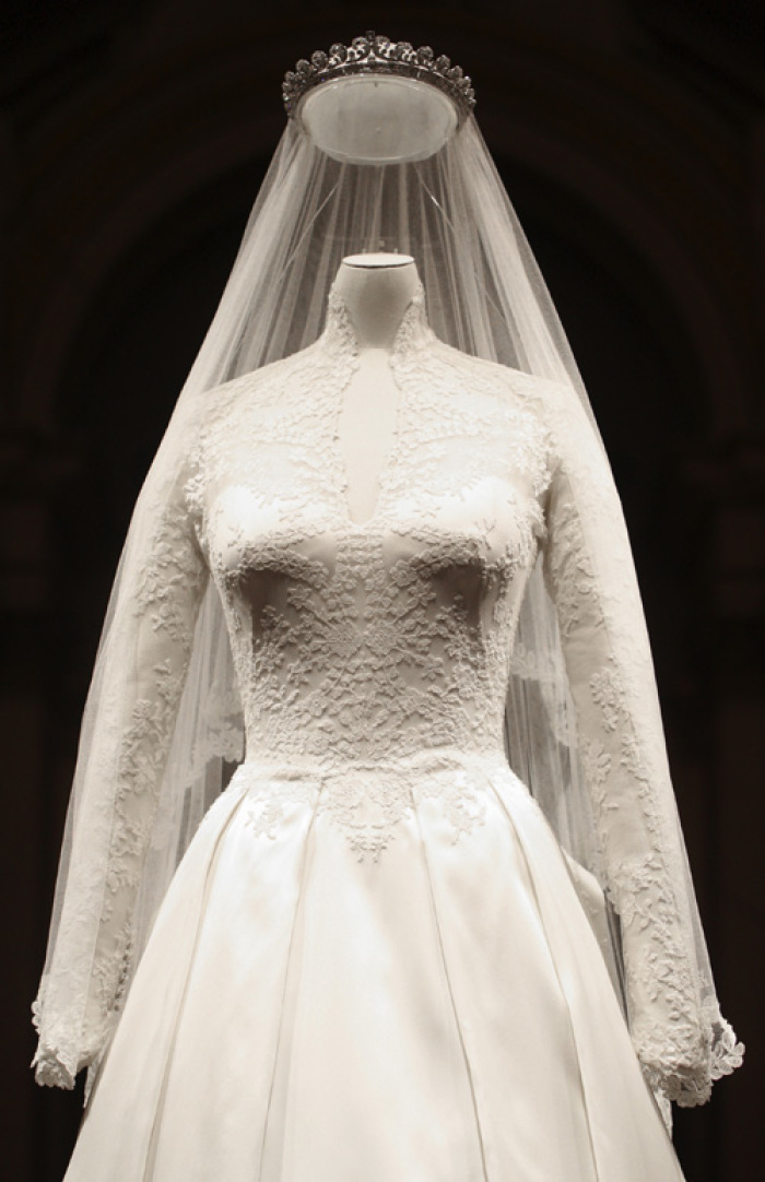 The wedding dress of Britain's Catherine, Duchess of Cambridge is seen as it is prepared for display at Buckingham Palace in London July 20, 2011. Buckingham Palace expects record crowds this summer as up to 650,000 people are set to file into Queen Elizabeth's London residence and past the dress worn by Kate Middleton at her royal wedding to Prince William. The ivory and white garment, designed by Sarah Burton for Alexander McQueen, won over the fashion press and public when Middleton, now the Duchess of Cambridge and a future queen, walked up the aisle of Westminster Abbey in April. Picture taken July 20, 2011.
