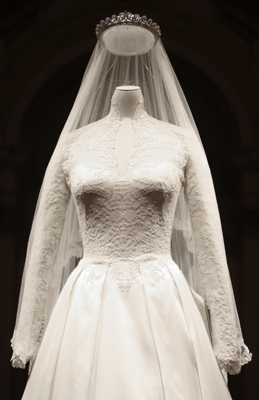 The wedding dress of Britain's Catherine, Duchess of Cambridge is seen as it is prepared for display at Buckingham Palace in London July 20, 2011. Buckingham Palace expects record crowds this summer as up to 650,000 people are set to file into Queen Elizabeth's London residence and past the dress worn by Kate Middleton at her royal wedding to Prince William. The ivory and white garment, designed by Sarah Burton for Alexander McQueen, won over the fashion press and public when Middleton, now the Duchess of Cambridge and a future queen, walked up the aisle of Westminster Abbey in April. Picture taken July 20, 2011.