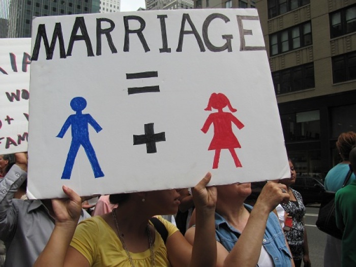 A protester holds up a sign in support of the traditional definition of marriage at the 'Let the People Vote' rally in New York City on July 24, 2011.