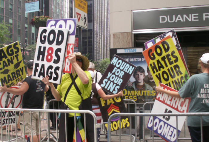 Westboro Baptist Church members held signs of anger in protest of same-sex marriage on July 24, 2011.