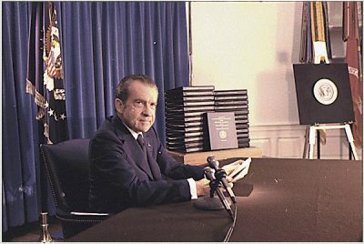President Nixon, with edited transcripts of Nixon White House Tape conversations during the broadcast of his address to the nation.