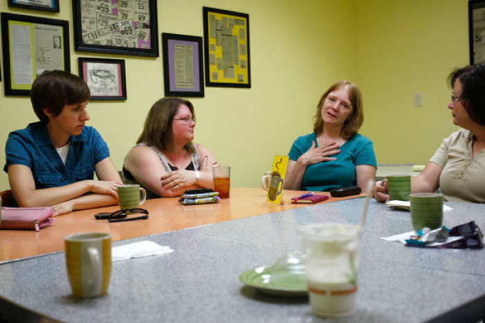 (L-R) Members of Hope Wesleyan Church Tesia Greenwell, 25, Elissa Haywood, 28, Darla Shulz, 49, and Amy Solon, 43, talk during their Morning Perks prayer meeting at a local coffee shop in Independence, Iowa July 5, 2011.