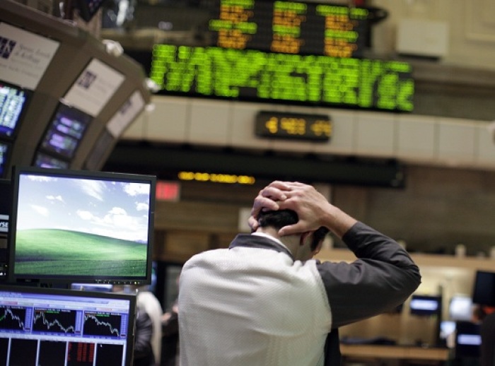 A trader works on the floor of the New York Stock Exchange August 4, 2011. Investors fled Wall Street in the worst stock-market selloff since the depths of the Great Recession in early 2009 in what has turned into a full-fledged correction.