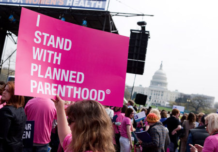 Members of Planned Parenthood, NARAL Pro-Choice America and more than 20 other organizations hold a 