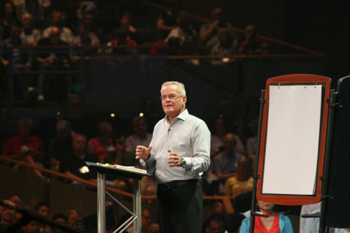 Pastor Bill Hybels, founder of Willow Creek Community Church, addresses thousands at the 2011 Willow Creek Leadership Summit in South Barrington, Ill.