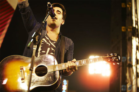 Christian artist Phil Wickham leads worship at the 2011 Harvest Crusade. A total of 115,000 attended the evangelistic event, held Aug. 12-14. More than 12,000 people made decisions for Christ over the three days.