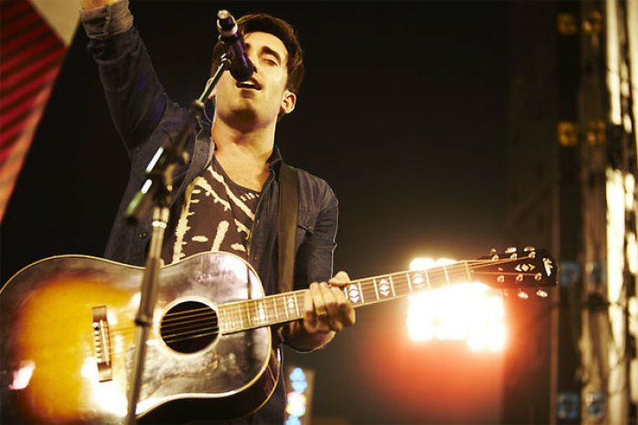 Christian artist Phil Wickham leads worship at the 2011 Harvest Crusade. A total of 115,000 attended the evangelistic event, held Aug. 12-14. More than 12,000 people made decisions for Christ over the three days.