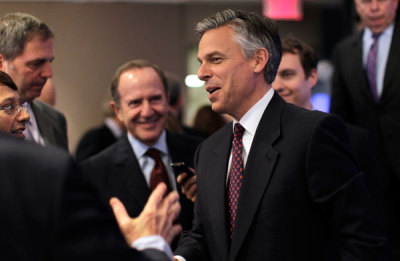 Former Utah Governor Jon Huntsman is greeted after speaking at an event hosted by Thomson Reuters in New York, June 14, 2011.
