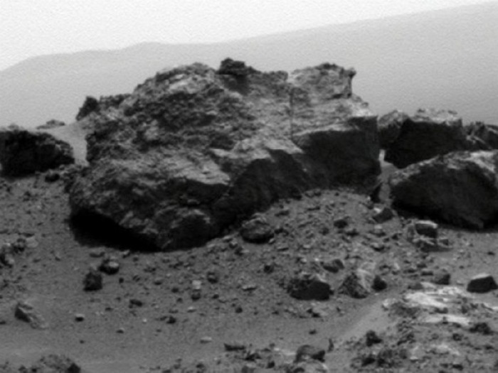 NASA's Mars Exploration Rover Opportunity looked across a small crater on the rim of a much larger crater to capture this raw image from its panoramic camera during the rover's 2,685th Martian day, or sol, of work on Mars (Aug. 13, 2011).