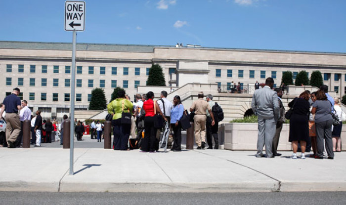 Civilians and members of the U.S. military are pictured outside the Pentagon following an earthquake along the eastern United States, August 23, 2011.