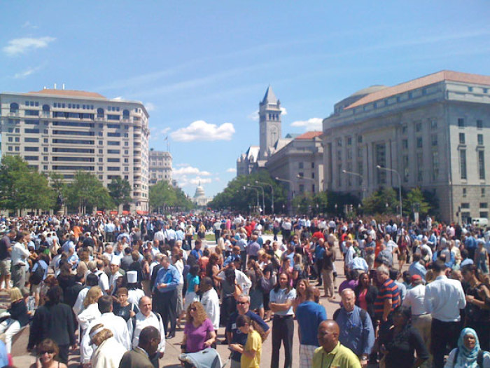 Workers evacuated from their offices in downtown Washington, D.C. gathered on Pennsylvania Avenue between the White House and the U.S. Capitol on Tuesday, August 23, 2011, shortly after a 5.9 magnitude earthquake struck central Virginia and rattled cities from Toronto to Atlanta.