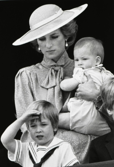 Prince William is seen making a royal salute as he watches the scene of Trooping the Colour from the balcony of Buckingham Palace with his brother Harry and mother Princess Diana in London in this June 15, 1985 file photograph. Britain's Prince William is to marry his long-term girlfriend Kate Middleton next year, Buckingham Palace said on November 16, 2010.