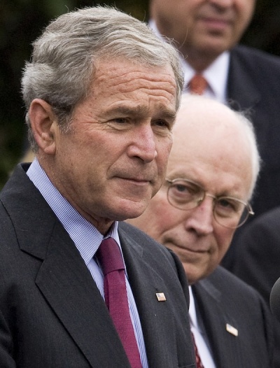 U.S. President George W. Bush (L) discusses the transition with the incoming administration of U.S. President-elect Barack Obama with staff members, on the South Lawn of the White House, in this file image from November 6, 2008. U.S. Vice President Dick Cheney is on right. The CIA withheld information from Congress about a secret counterterrorism program on orders from Cheney, a leading U.S. senator said on July 12, 2009.