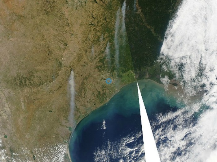 The stream of smoke flows from Bastrop County in central Texas south to the Gulf Coast. NASA released these satellite images of the wildfires that have been scorching Texas ground taken on September 5th.