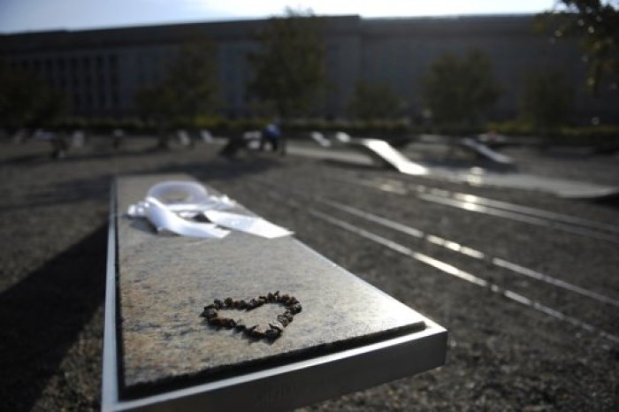 A heart made of small pebbles sits on a bench at the Pentagon Memorial at the site of the September 11, 2001, attack at the Pentagon near Washington, September 10, 2011. Each bench is placed in honor of a person who was killed in the attack, 59 passengers on American Airlines Flight 77 that crashed into the building and 125 people on the ground.
