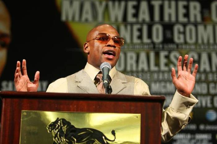 Floyd Mayweather Jr. of the U.S. answers questions during a news conference following his fight against Victor Ortiz, also of the U.S., at the MGM Grand Garden Arena in Las Vegas, Nevada September 17, 2011. Mayweather Jr took the WBC welterweight title from Ortiz with a controversial fourth-round knockout on Saturday that prompted an angry response from the crowd and raised questions about his conduct in the ring.