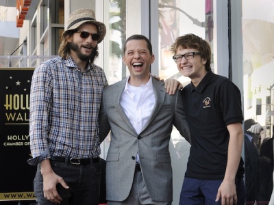 Jon Cryer (C) poses with his TV series 'Two and a Half Men' co-stars Ashton Kutcher (L) and Angus T. Jones (R) during a ceremony honoring Cryer with a star on the Hollywood Walk of Fame in Los Angeles September 19, 2011.