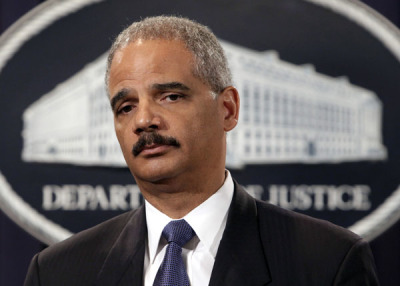 U.S. Attorney General Eric Holder holds a news conference to deliver the results to date of the largest prosecution of an international criminal network organized to sexually exploit children, at the Justice Department in Washington August 3, 2011.